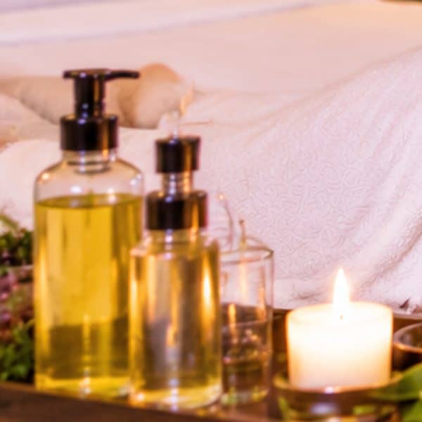 Aromatic massage oils and candle